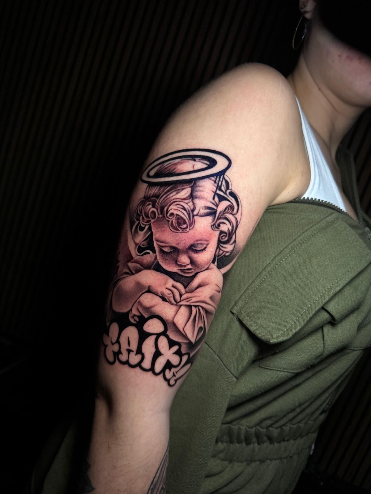 Realistic cherub tattoo with halo