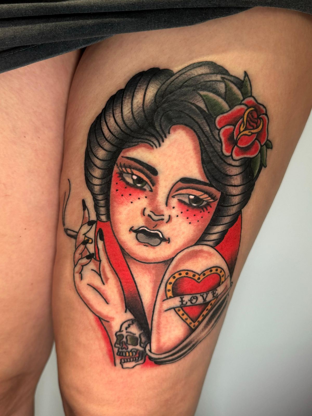 Colour American traditional pin-up tattoo
